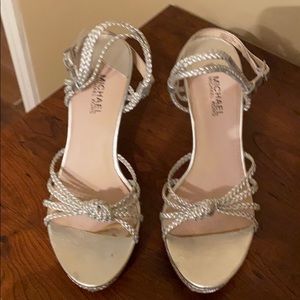 Super cute Michael by Michael Kors silver wedges.